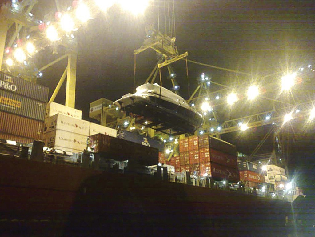 The 5800 Sport Yacht being lifted aboard the ship in Sydney late in the evening earlier this week for her passage to New Zealand.  © Stephen Milne